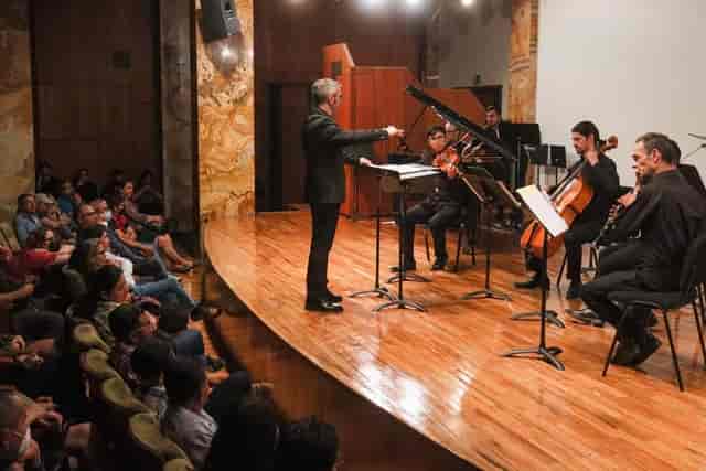 Recital on wooden stage in Sala Manuel M. Ponce, Palacio de Bellas Artes for musical events.