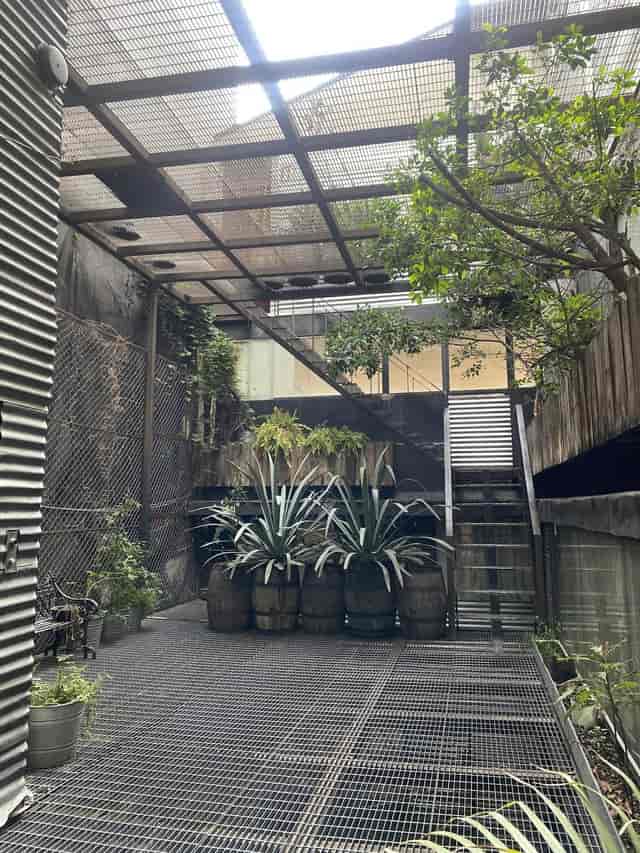 Industrial-chic art gallery courtyard for boutique cocktail receptions and corporate events.