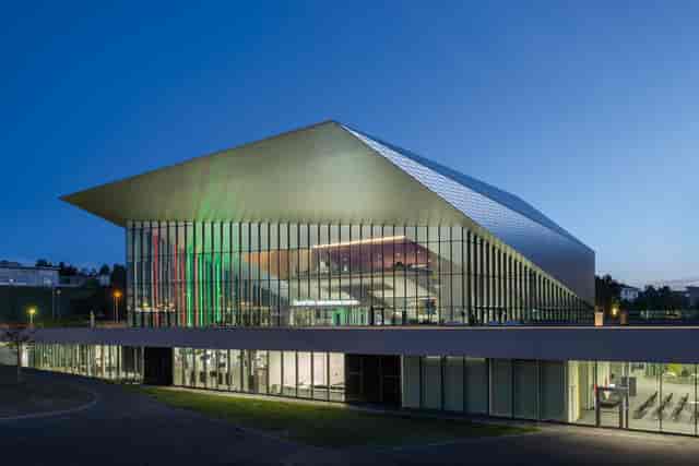 Modern SwissTech Convention Center foyer with glass walls for professional corporate conferences.