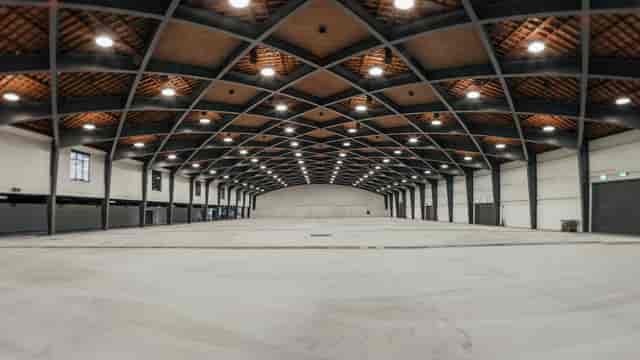 Beaulieu Lausanne exhibition hall: high-ceilinged industrial space for trade shows and events.
