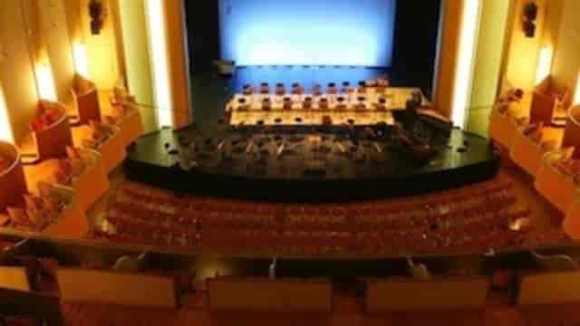 Salle Métropole auditorium with proscenium stage for keynote presentations and panel discussions.