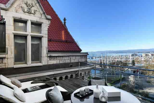 Vinothèque VIP waterfront terrace at Château d'Ouchy for executive retreats and networking events.