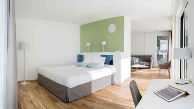 Lord Byron Hotel junior suite with modern workspace, perfect for executive business travel.