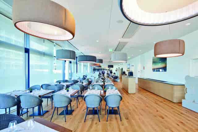 Modern Aquatis Hotel conference center with modular seating for corporate networking events.