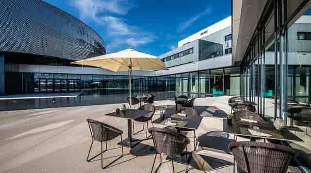Modern outdoor terrace at Aquatis Hotel for corporate networking and professional cocktail events.