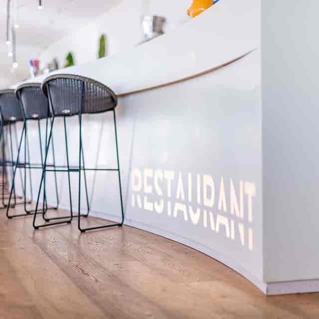Modern Aquatis Hotel bar for networking events and corporate registration.