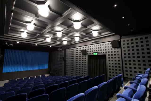Le Salon screening room at Casino de Montbenon with tiered seating for corporate events and cinema.