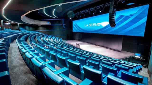 Modern auditorium in Millennium Center with LED stage for keynote presentations and conferences.