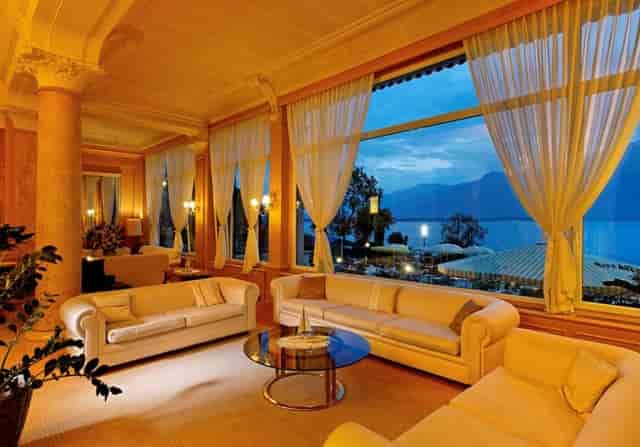 Byron Room at Eden Palace au Lac featuring floor-to-ceiling lake views for luxury networking events.