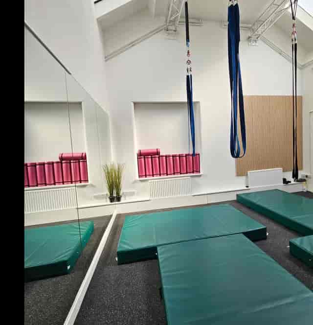 Multipurpose dance studio with mirrored wall, ideal for wellness retreats and workshops.