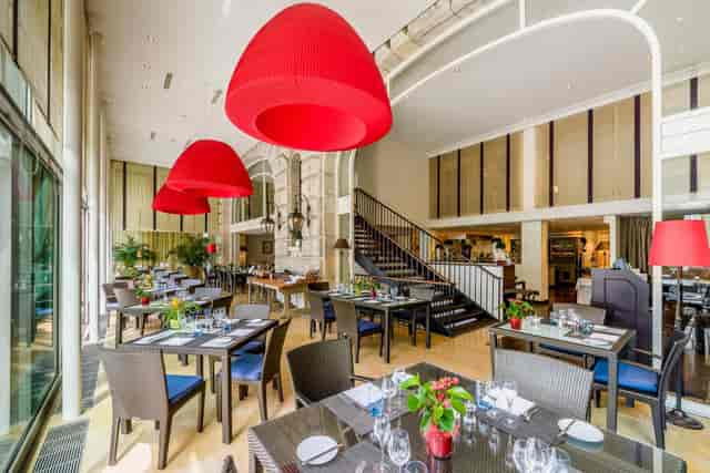 Upscale Côté Jardin restaurant dining space for corporate lunch and networking events.