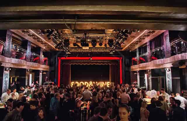 Edison Ballroom venue bustling with attendees at a food and wine event.