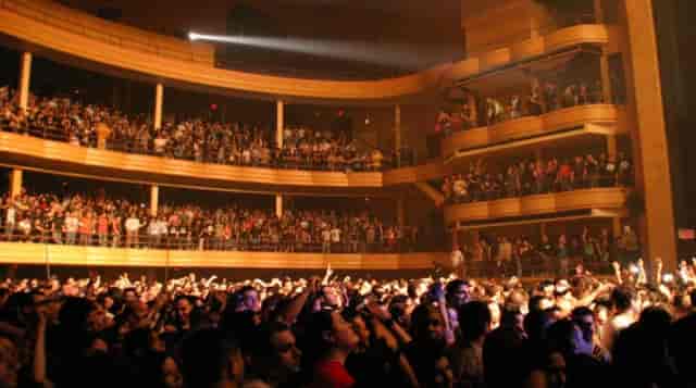 Packed Grand Ballroom in Manhattan Centre during a live performance, showcasing audience engagement.