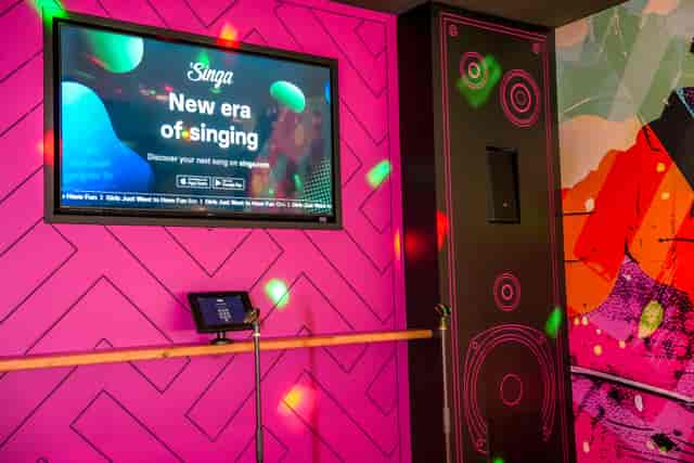 Vibrant karaoke room in King Pins Leeds for fun team-building events and social gatherings.
