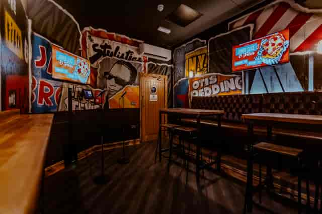 Karaoke room with mural branding at Roxy Ball Room, perfect for team building and private parties.