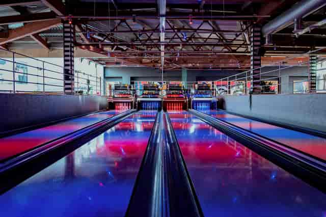 Vibrant bowling lanes with LED lighting for corporate events in Liverpool's Roxy Ball Room.