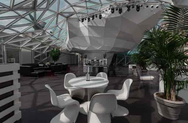 Modern geometric event space in La Lanterna Rome, ideal for corporate gatherings and presentations.