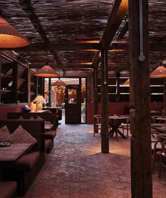 Cozy rustic venue with wooden beams for intimate gatherings and networking events.
