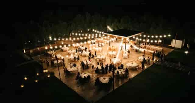 Outdoor wedding venue in Heritage with bistro lighting for evening gala events.