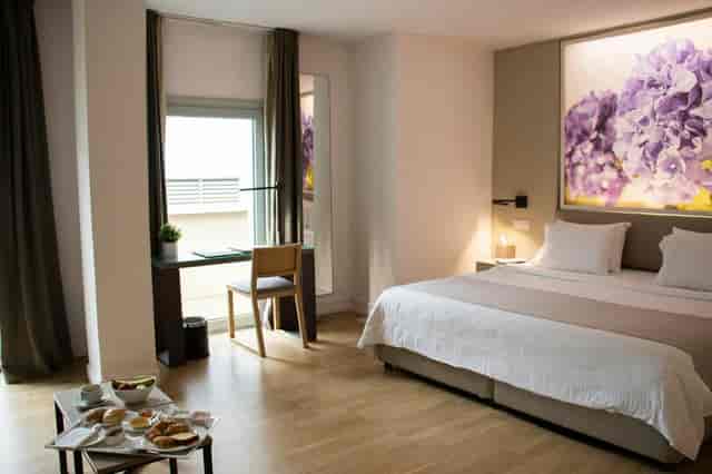 Executive hotel room at Michael Angelo Nicosia with workspace for bleisure and business events.