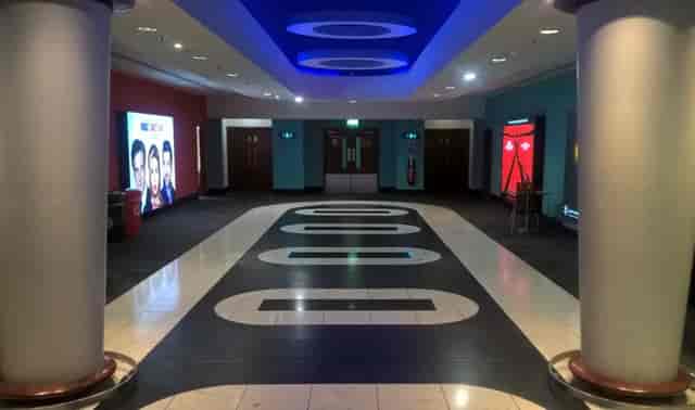 Vue Leeds event corridor with vibrant design, ideal for registration and networking.