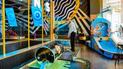 Vibrant mini-golf venue for team-building and social events in Manchester.