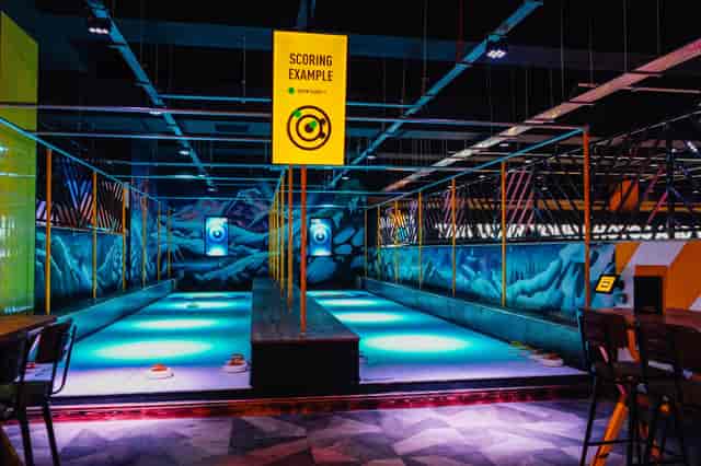 Vibrant event space with illuminated lanes at King Pins, Arndale Manchester for networking and team-building.