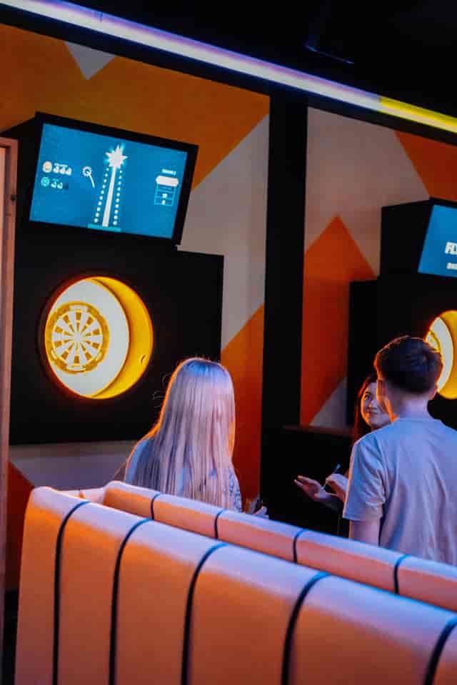 The Bullseye Zone at King Pins in Manchester, vibrant dartboard decor for events.