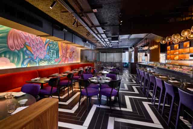 Stylish Itamae restaurant with vibrant mural, ideal for events and gatherings.