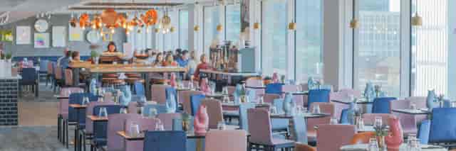 Modern meeting space with colorful chairs at The Reach, Piccadilly Manchester.