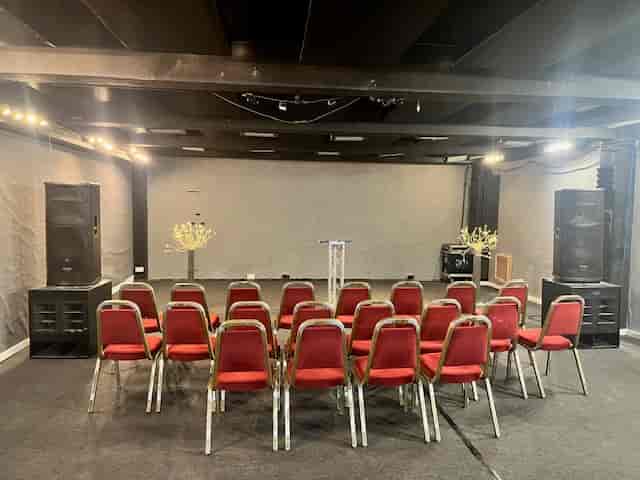 Premier Room 3 at Robannas Studios, featuring red chairs for workshops and presentations.