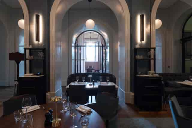 Supporters' House Blue Dining Room with plush furnishings for exclusive corporate events.