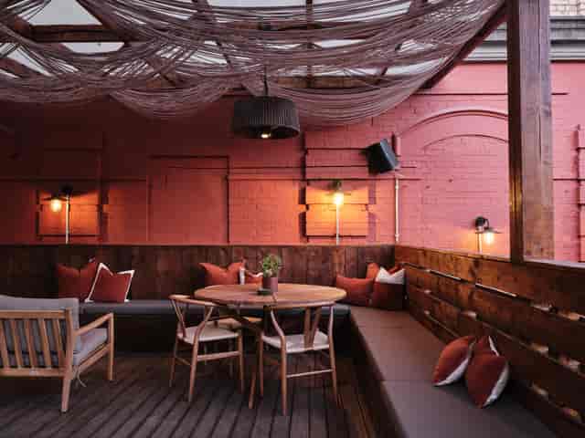 "Stylish outdoor event space at Pyro Hut with warm lighting for intimate gatherings"