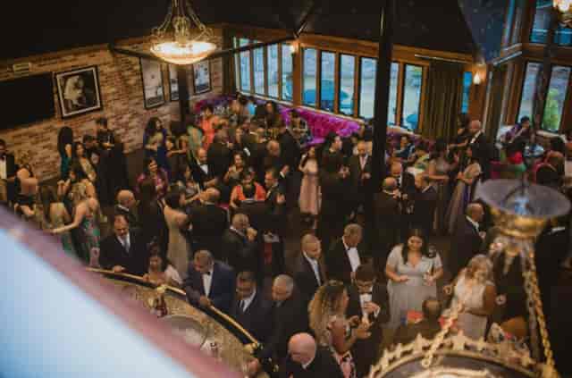 Formal networking event at Old Thorns with elegant attire and vibrant atmosphere.