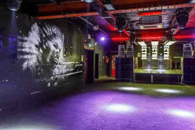 Industrial venue, graffiti art, urban event, concert