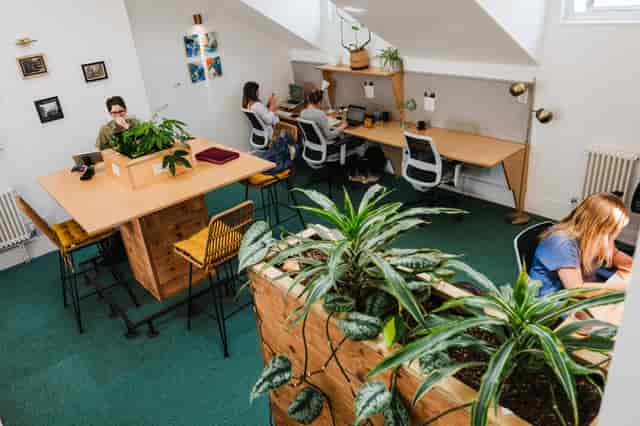 Modern breakout meeting room with collaborative seating for office event space rental.