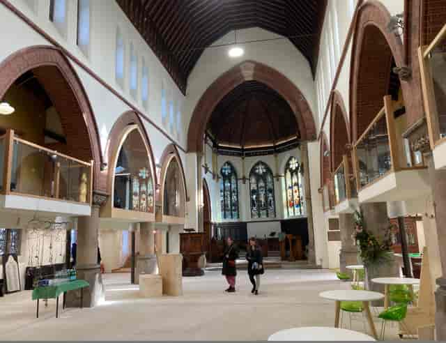 Elegant event space with stained glass windows at St Matthew's Community Centre.