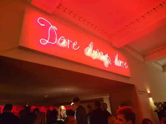The Old Vic neon sign at an evening networking event and corporate function.