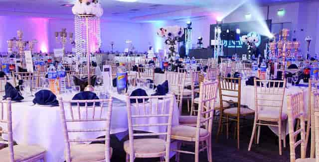 Ballroom setup at Motor Hub Warwick with floral centerpieces for formal corporate events.