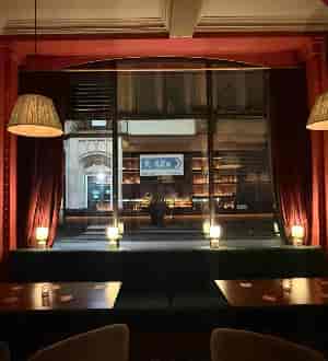 Atmospheric bar interior with plush drapery, ideal for upscale evening receptions and private events.