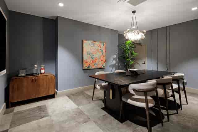 Modern conference room with sleek table, ideal for intimate meetings and brainstorming sessions.