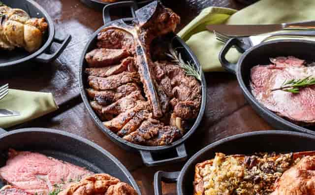 Family-style catering spread at Carne Hove, perfect for executive dinners and incentive galas.