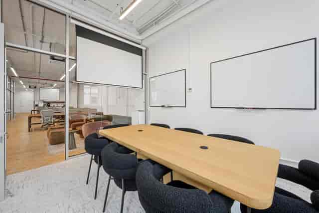 Mercer Meeting Room 402 A with oval table, ideal for corporate meetings and teamwork.