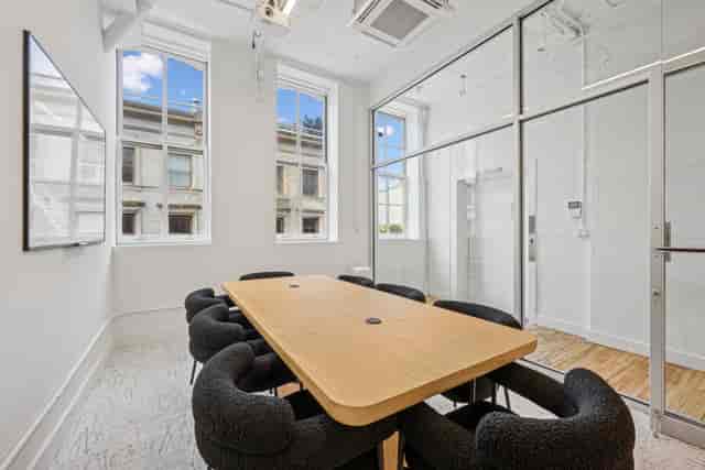 Bright Mercer Meeting Room 402 A with large windows, ideal for meetings and brainstorming.