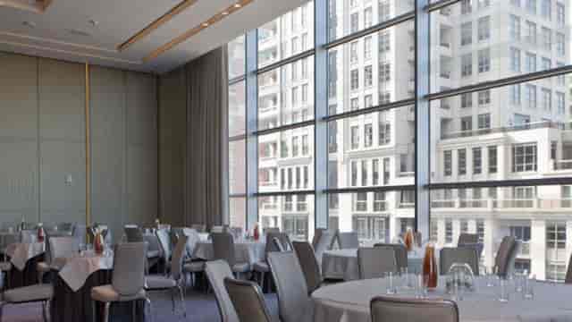 Four Seasons Toronto banquet hall: light-filled conference space with floor-to-ceiling windows.