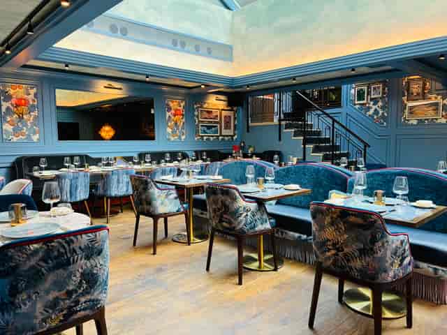 Ridge Room at VATAVARAN: Blue-toned venue for corporate dinner and networking events.