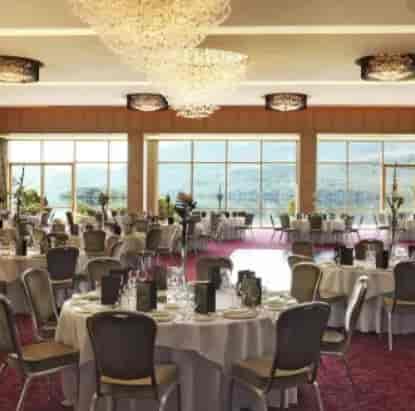 Elegant banquet hall with lake view, perfect for weddings and upscale events.