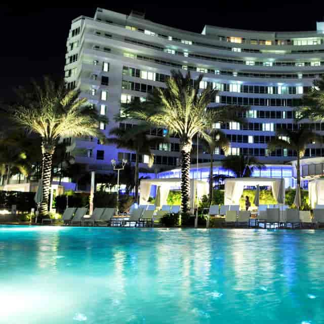 Luxurious hotel pool at night, perfect for elegant events and networking in Miami Beach.