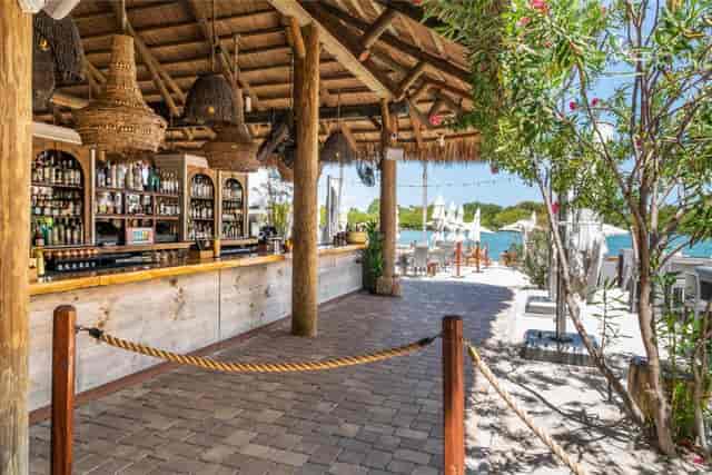 Joia Beach Miami outdoor venue with thatched bar for networking events and incentive breakouts.