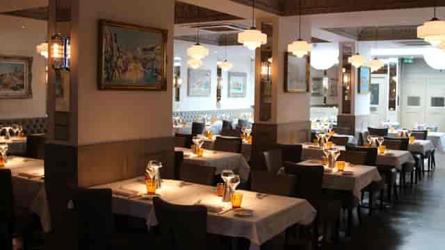 Private dining at Ole Kyiv: Elegant corporate dinner setting with sophisticated table arrangements.